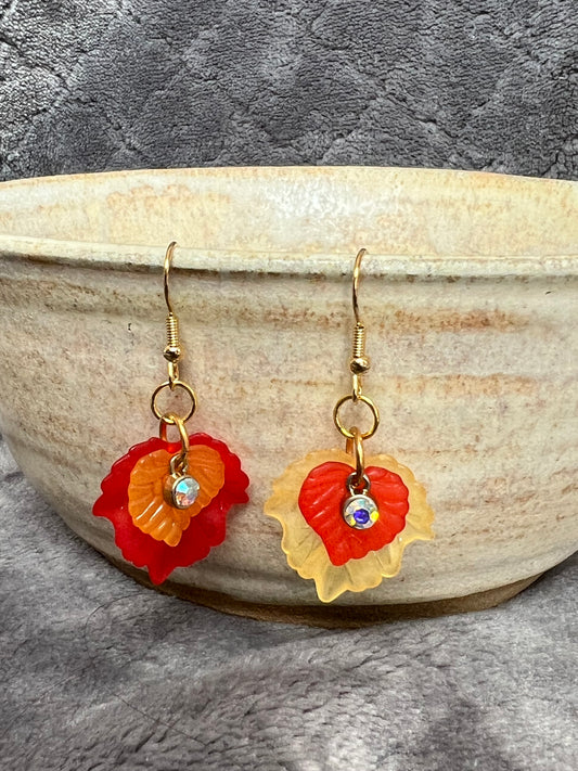 Earrings- Acrylic orange and red leaves with gold plated metal and AB crystals.