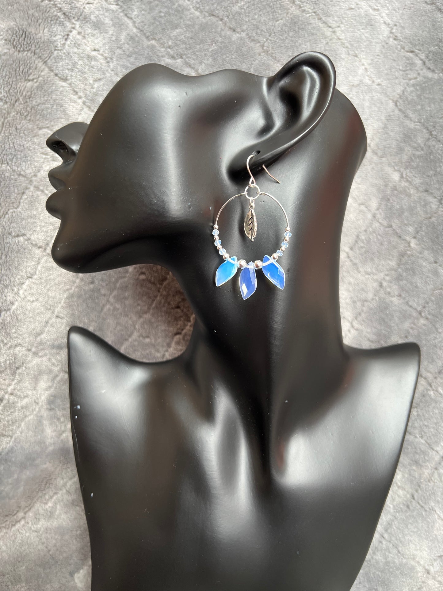 Earrings- Silver plated ear wires with opal quartz leaves and opal quartz spacer beads on a silver plated hoop.