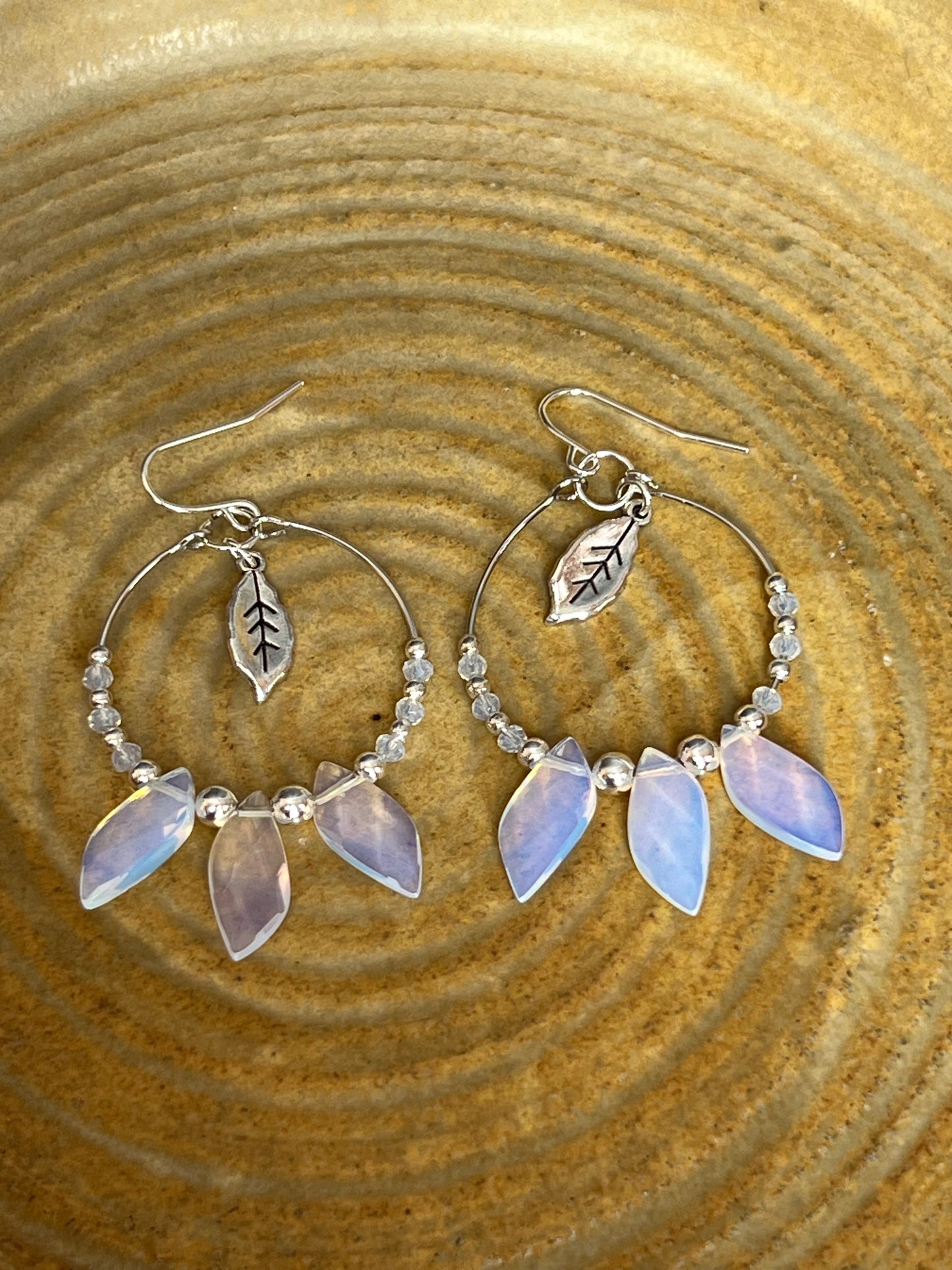 Earrings- Silver plated ear wires with opal quartz leaves and opal quartz spacer beads on a silver plated hoop.