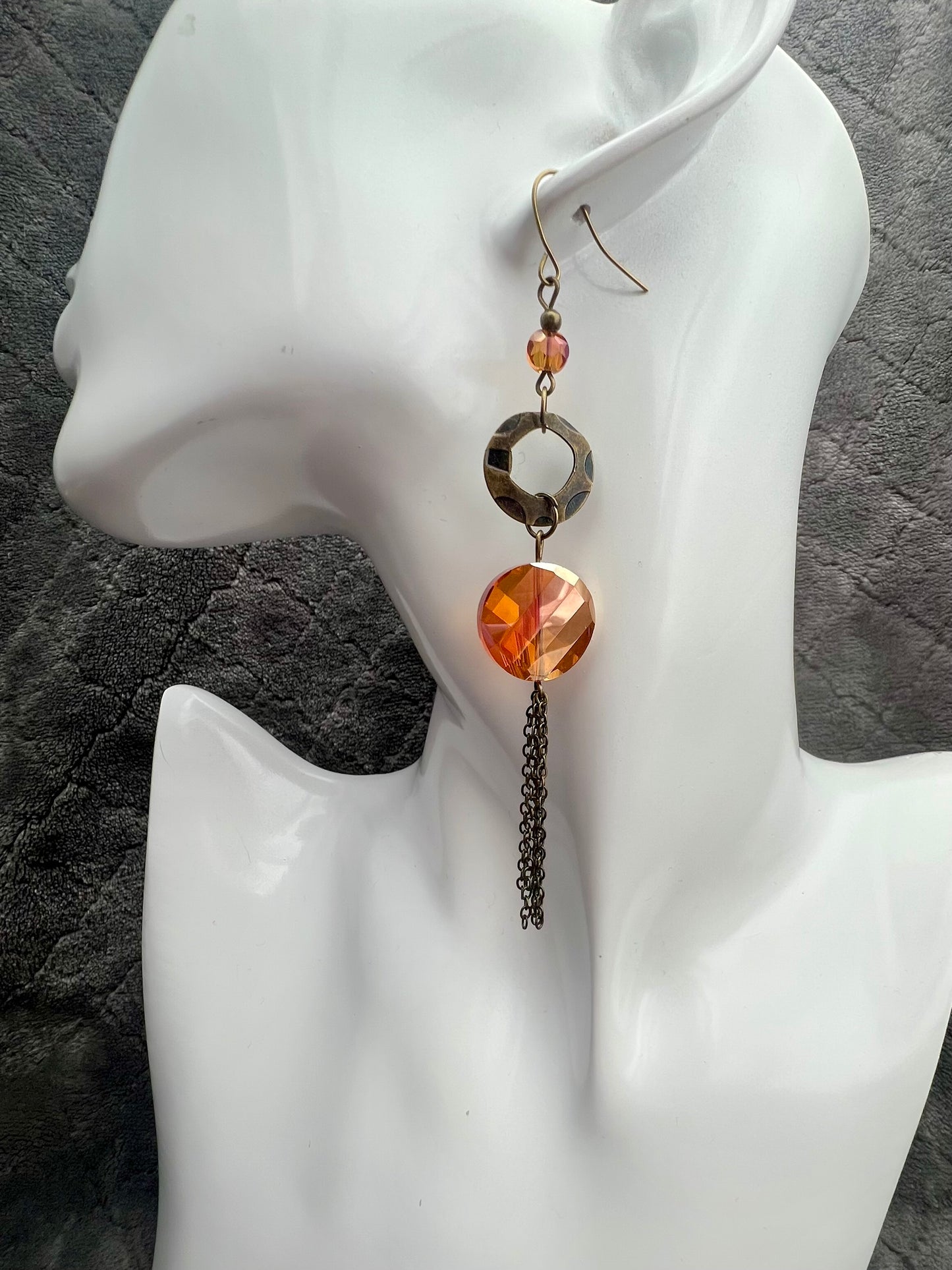 Earrings- Antique gold plated metal with orange/copper crystals with a luster coating.