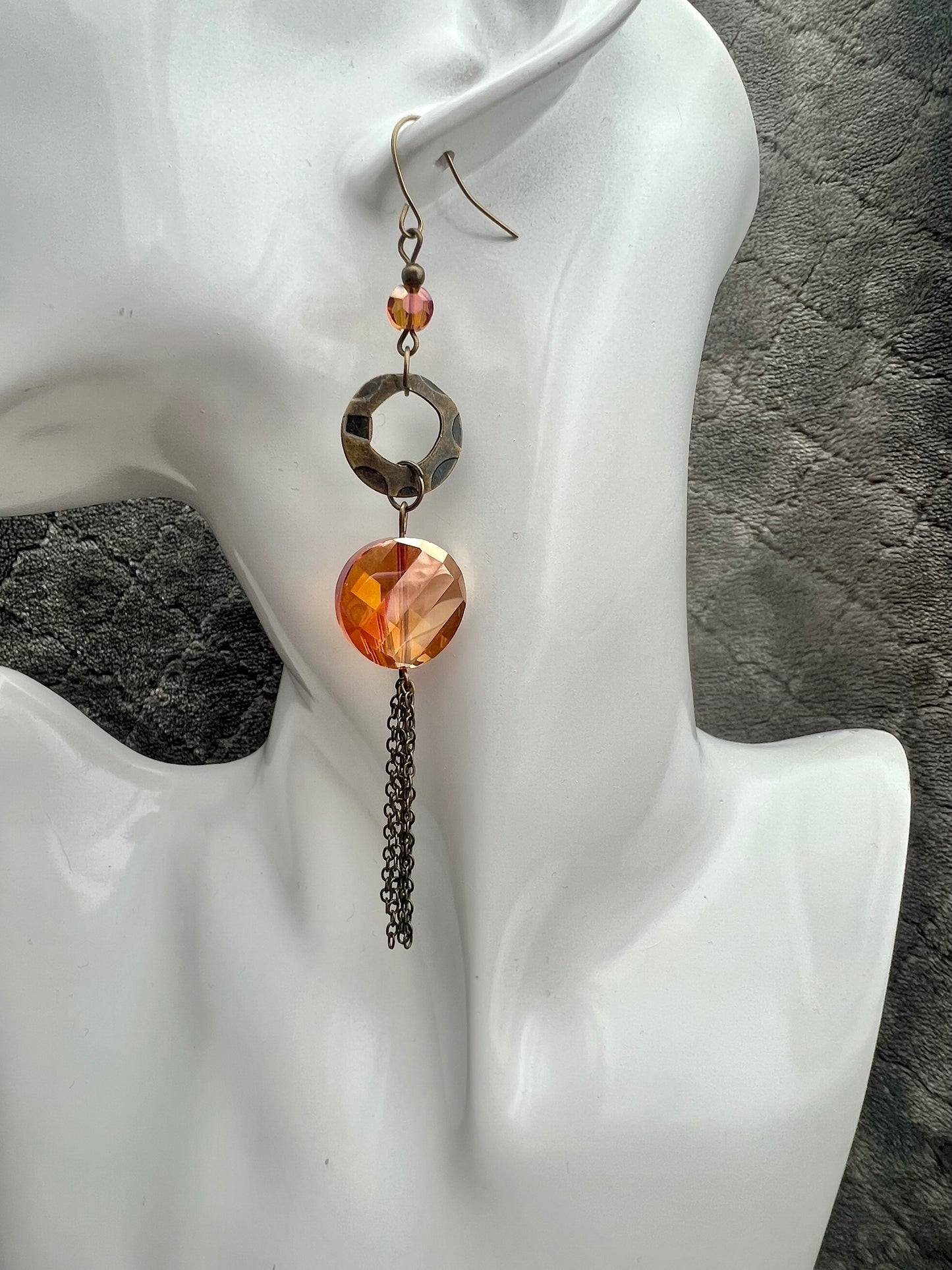 Earrings- Antique gold plated metal with orange/copper crystals with a luster coating.