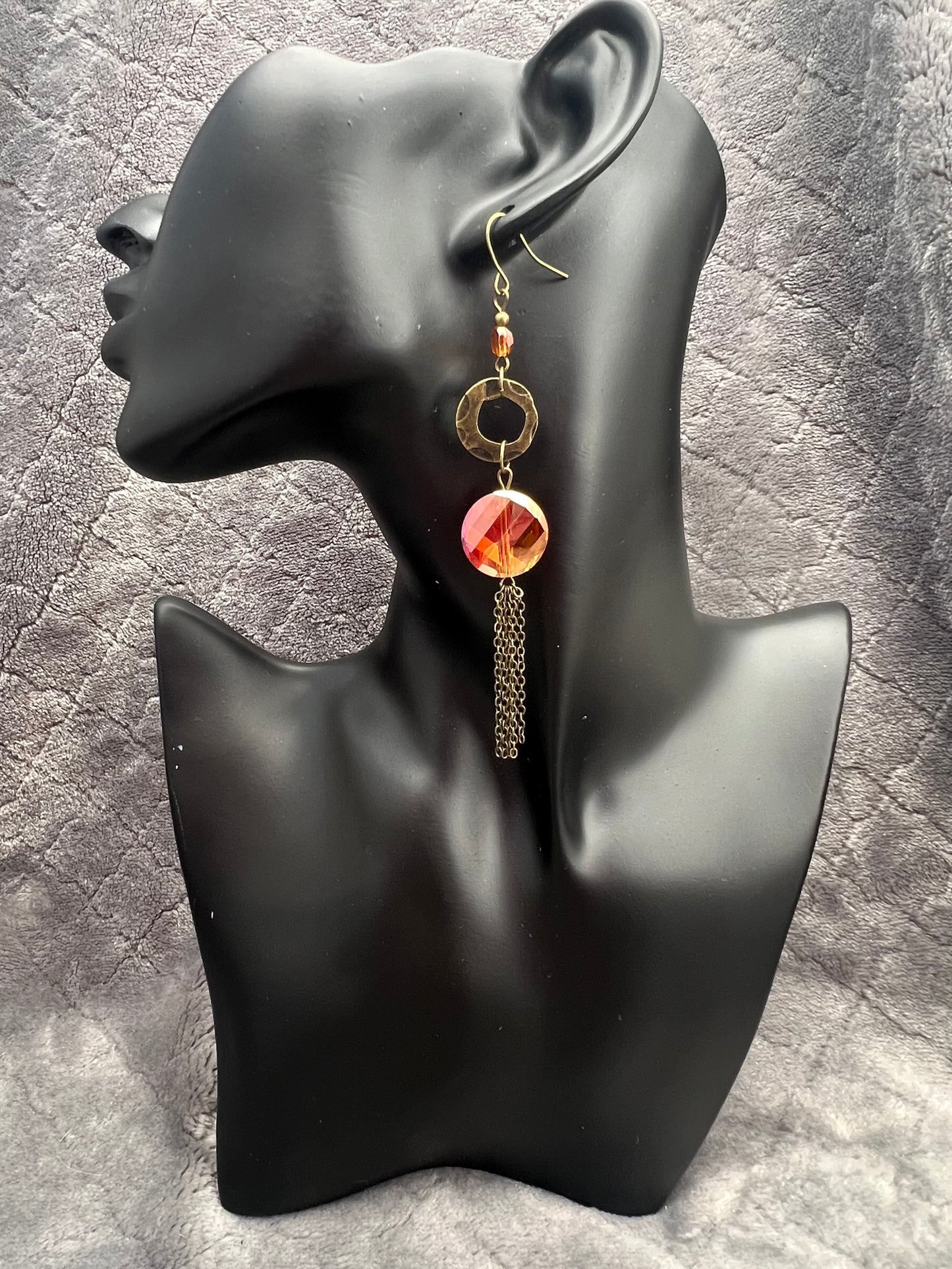 Earrings- Antique gold plated metal with orange/copper crystals with a luster coating.