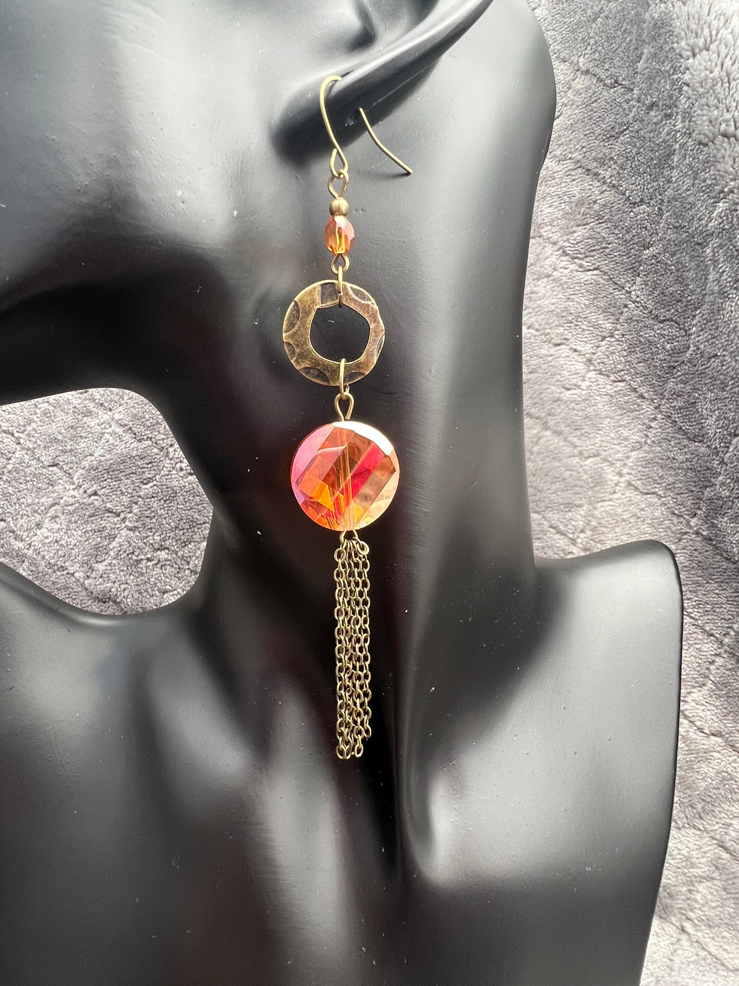 Earrings- Antique gold plated metal with orange/copper crystals with a luster coating.