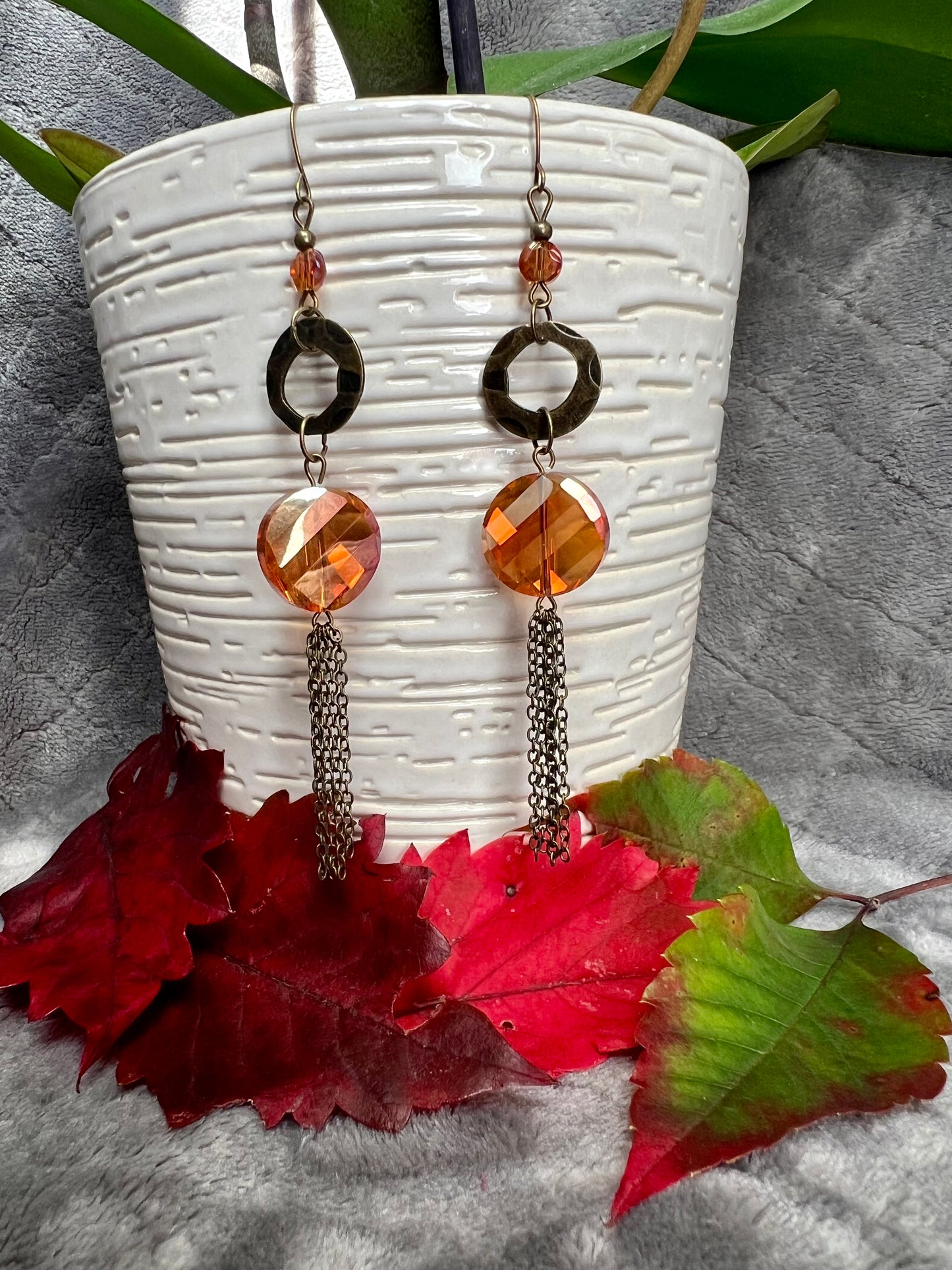 Earrings- Antique gold plated metal with orange/copper crystals with a luster coating.