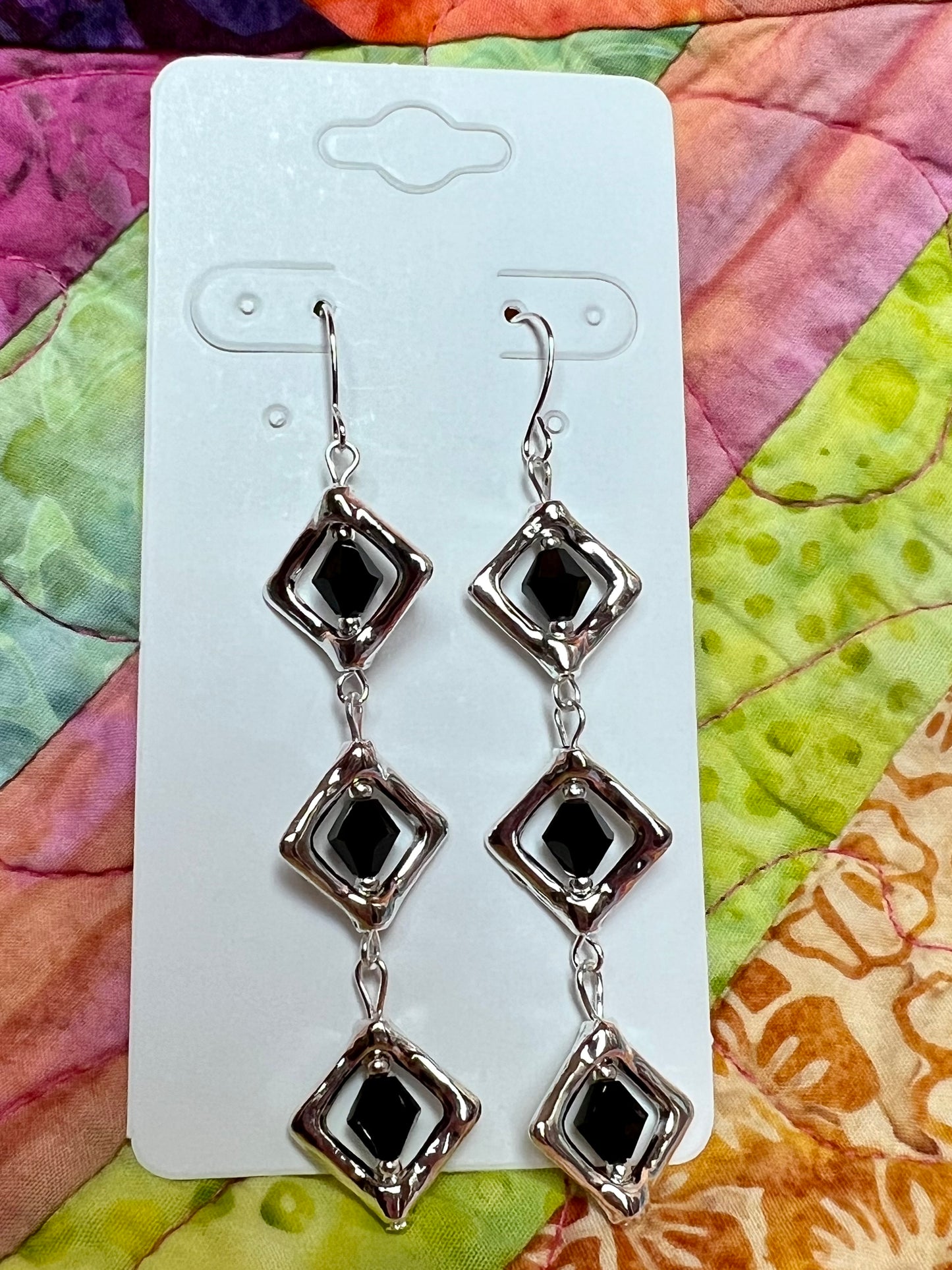 Earrings- Silver plated metal with black Czech crystals.