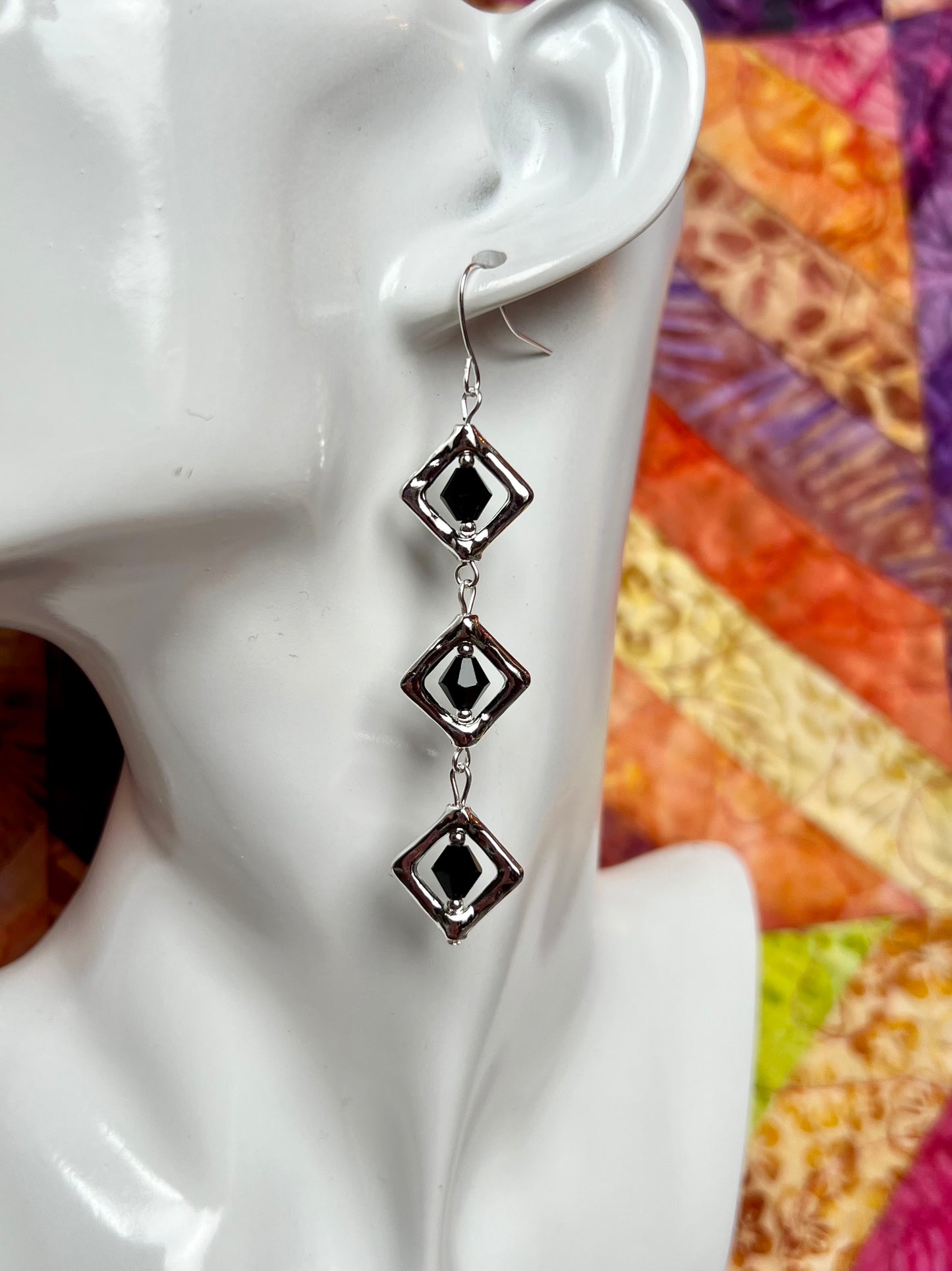 Earrings- Silver plated metal with black Czech crystals.