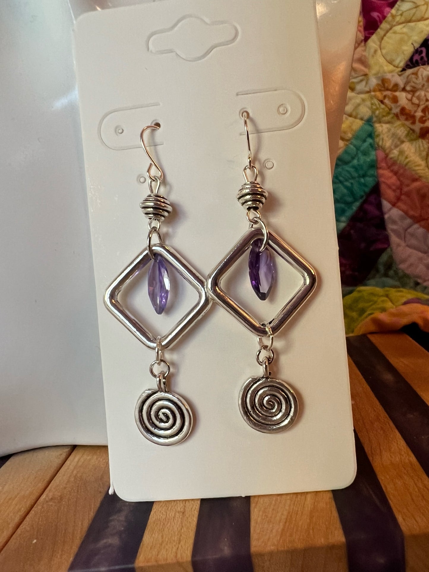 Earrings- Antiqued silver plated metal beads with purple cubic zirconia beads and swirl bead.